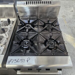 A stainless steel commercial gas stove with four black burners, labeled #13657-P on the front panel, sits on a concrete floor beside another kitchen appliance. MRCE