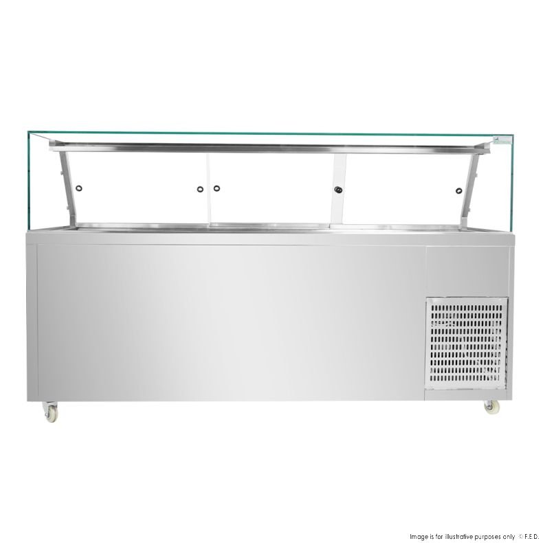 A stainless steel commercial refrigerated display counter with a glass sneeze guard, ventilation grate, and wheels, typically used for showcasing food in restaurants or cafeterias. MRCE
